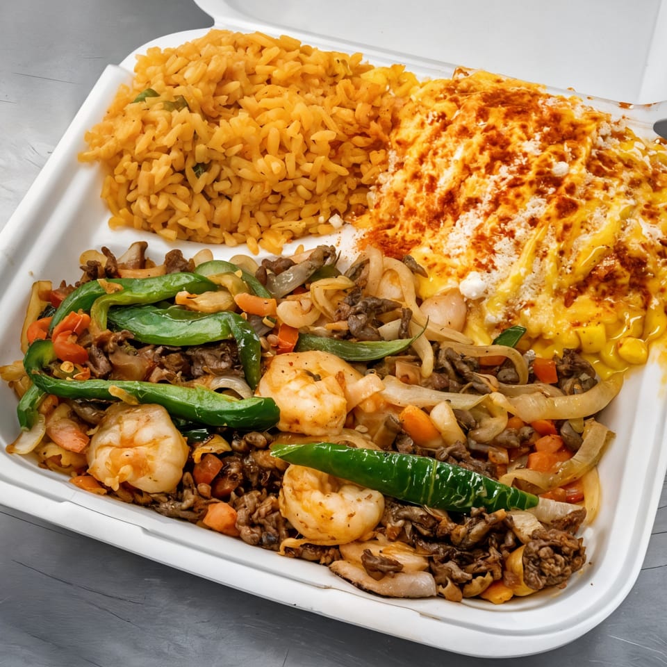 A Mexican take-out container with rice, cheesy corn, and a shrimp and beef fajita mix.